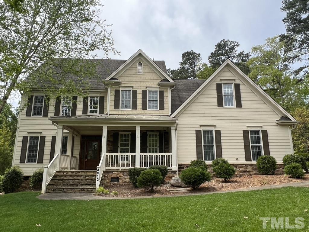 4012 Grandbridge Drive Apex, NC 27539 - Photo 1 of 51 a front view of a house with a yard