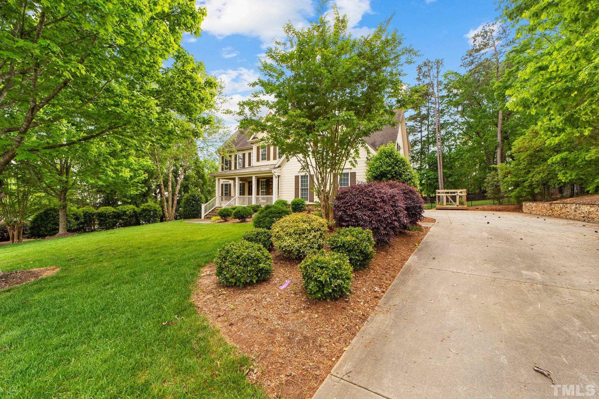 4012 Grandbridge Drive Apex, NC 27539 - Photo 12 of 51 a front view of a house with a yard