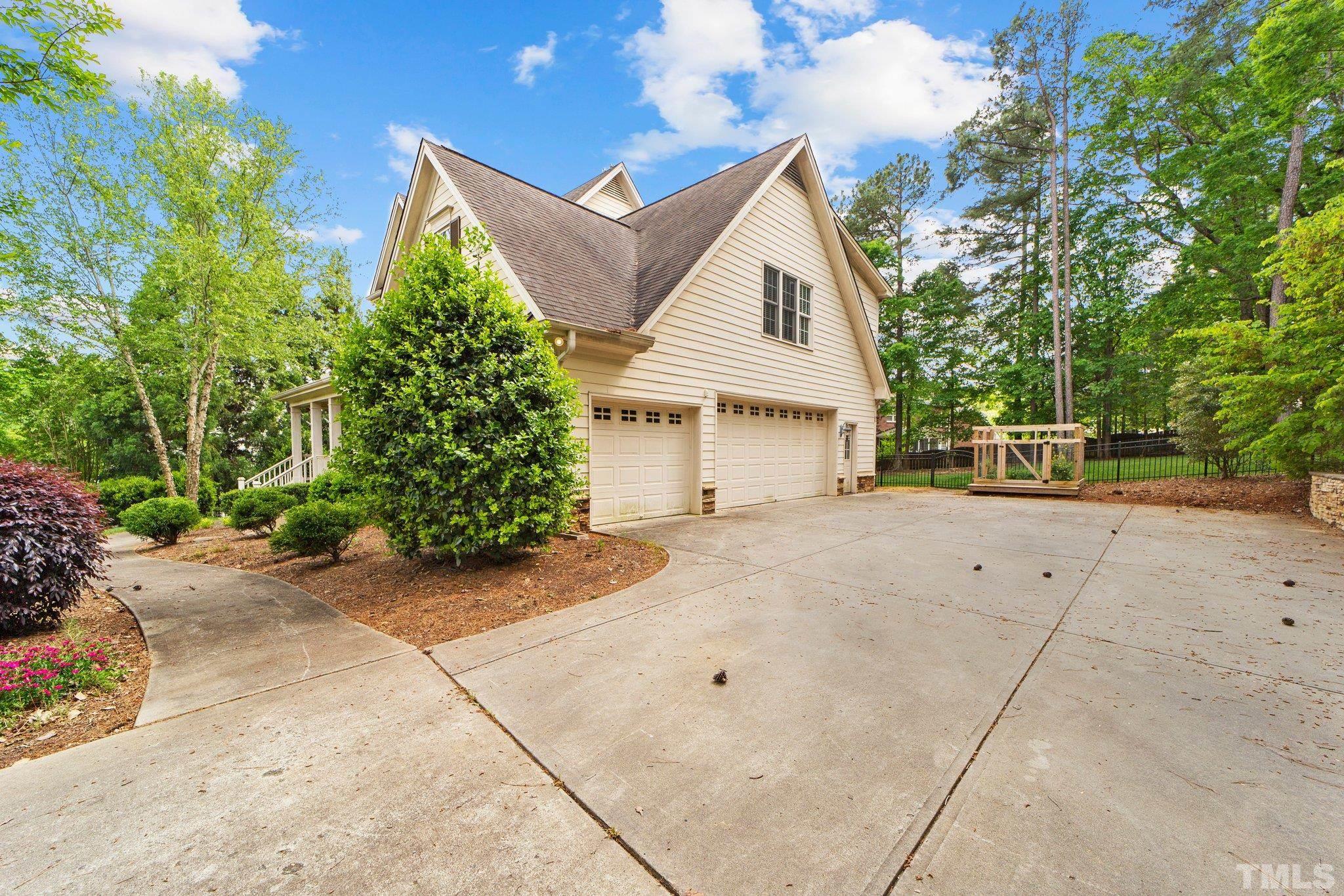 4012 Grandbridge Drive Apex, NC 27539 - Photo 15 of 51 a view of a house with a backyard