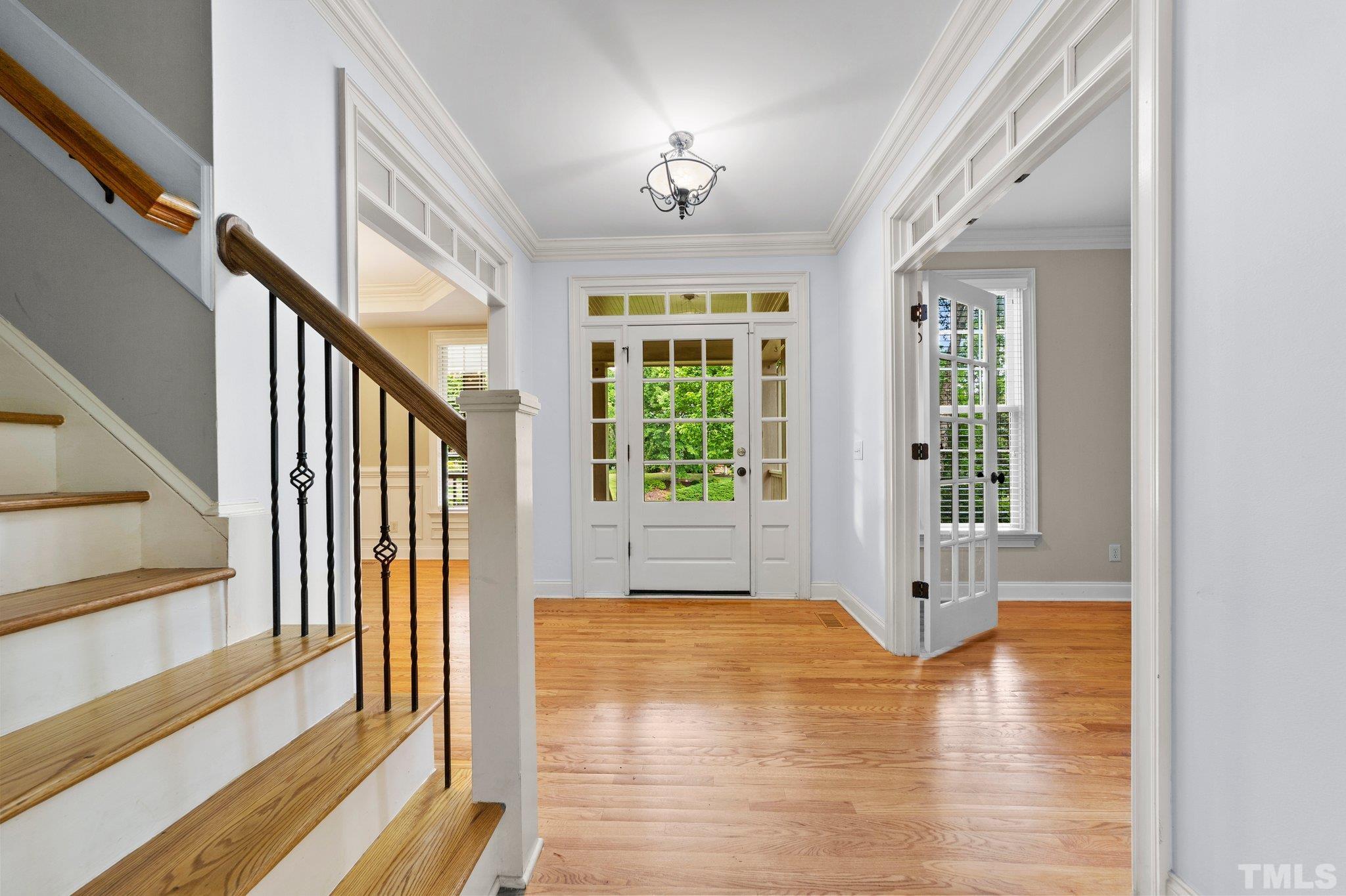4012 Grandbridge Drive Apex, NC 27539 - Photo 17 of 51 a view of an entryway with wooden floor and door