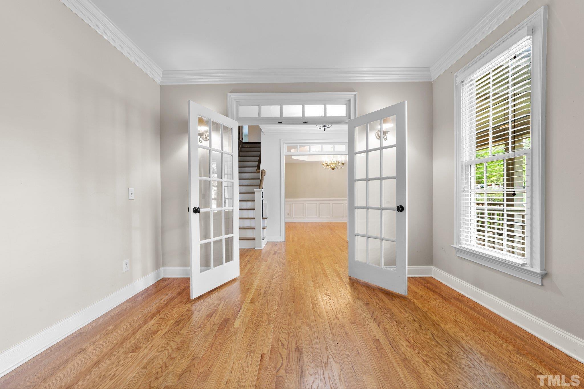 4012 Grandbridge Drive Apex, NC 27539 - Photo 19 of 51 a view of empty room with wooden floor and fan