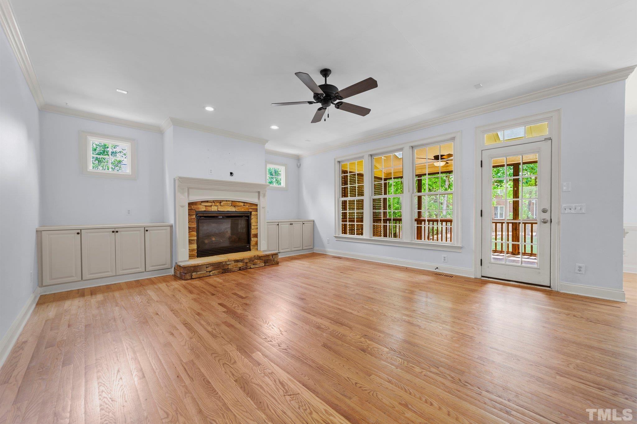 4012 Grandbridge Drive Apex, NC 27539 - Photo 20 of 51 a view of an empty room with a fireplace and a window