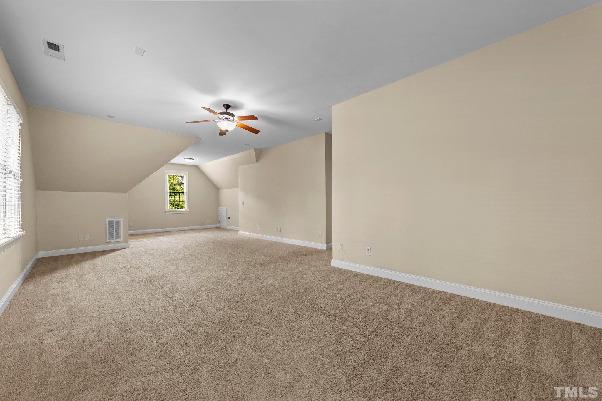 4012 Grandbridge Drive Apex, NC 27539 - Photo 34 of 51 an empty room with a window and a ceiling fan