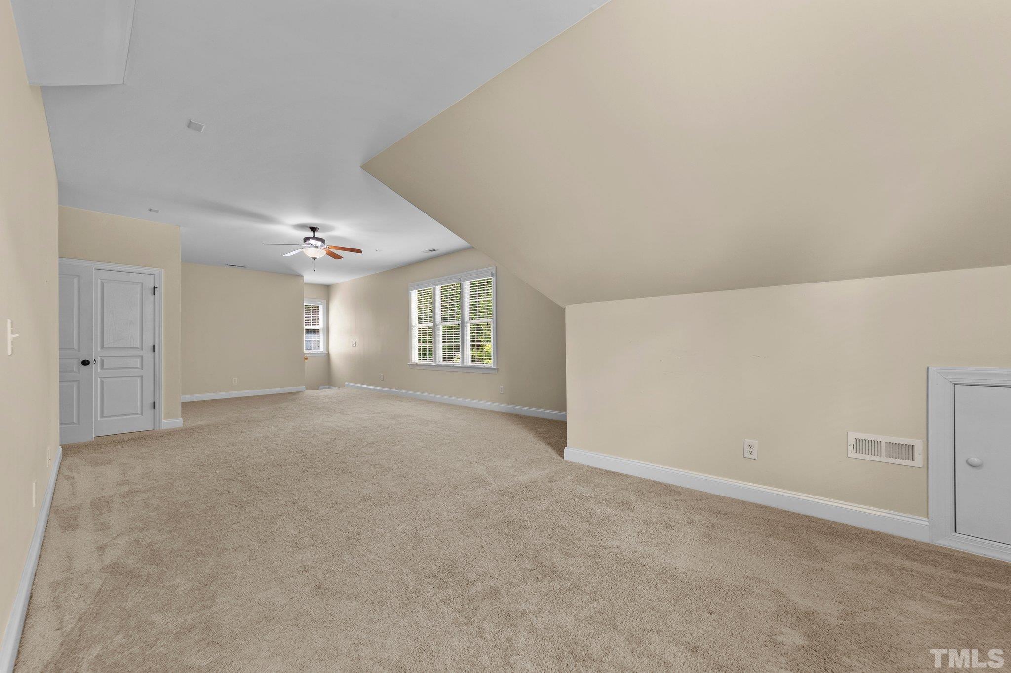 4012 Grandbridge Drive Apex, NC 27539 - Photo 35 of 51 an empty room with windows and closet