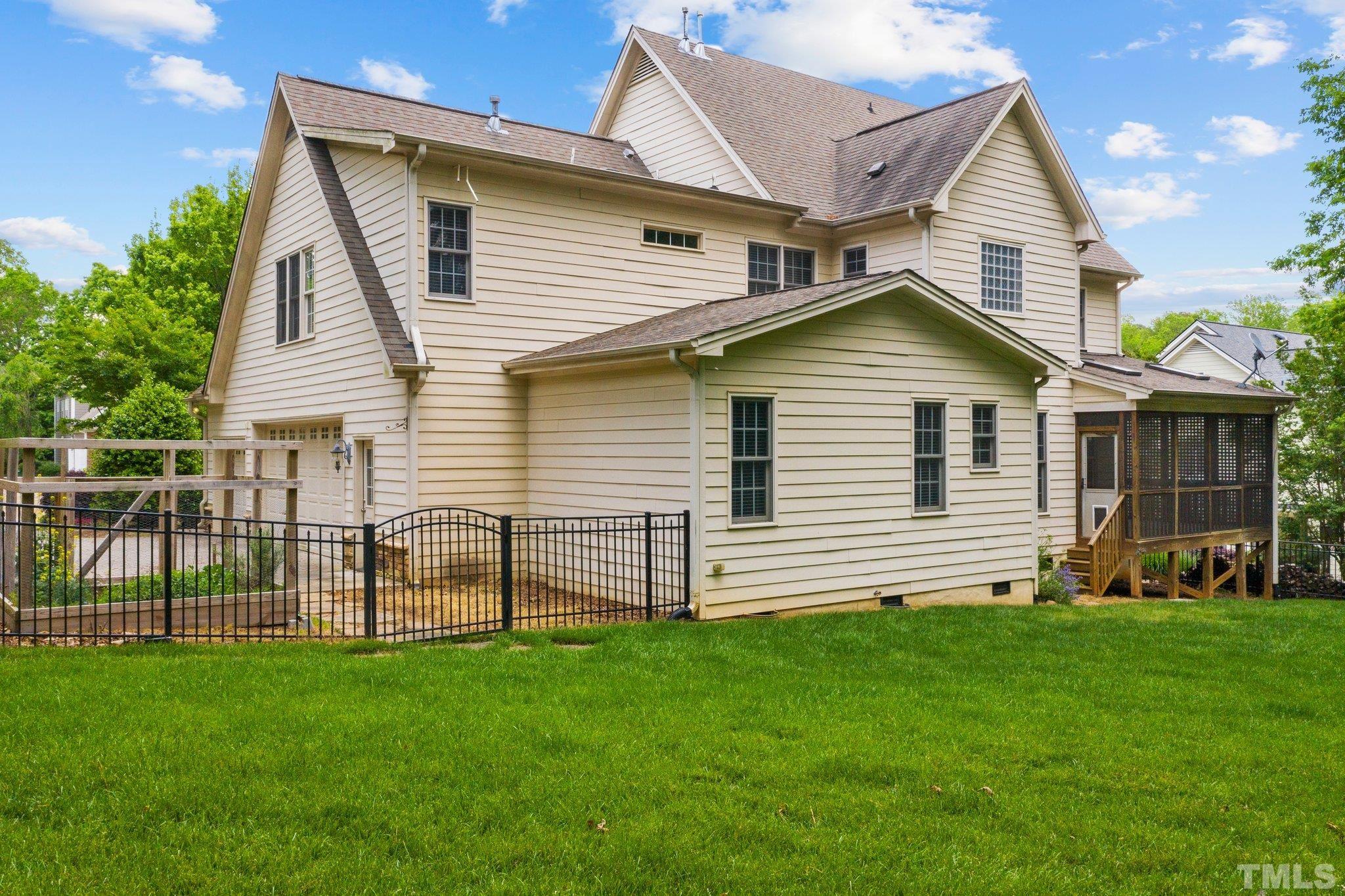 4012 Grandbridge Drive Apex, NC 27539 - Photo 4 of 51 a front view of a house with a garden