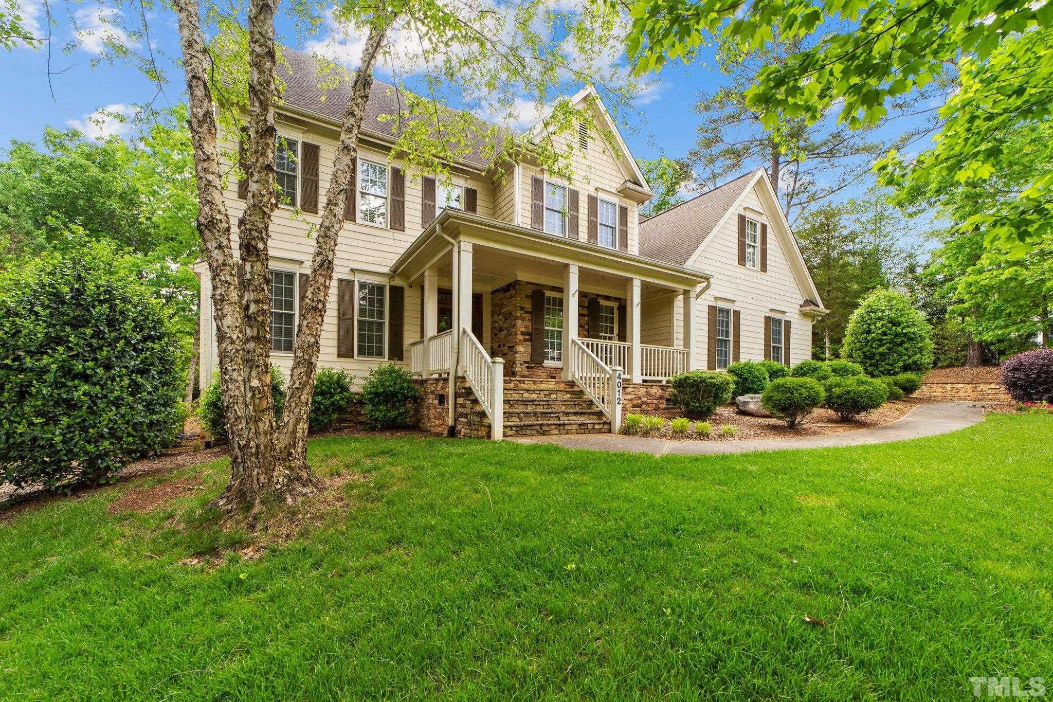4012 Grandbridge Drive Apex, NC 27539 - Photo 5 of 51 a front view of a house with a garden