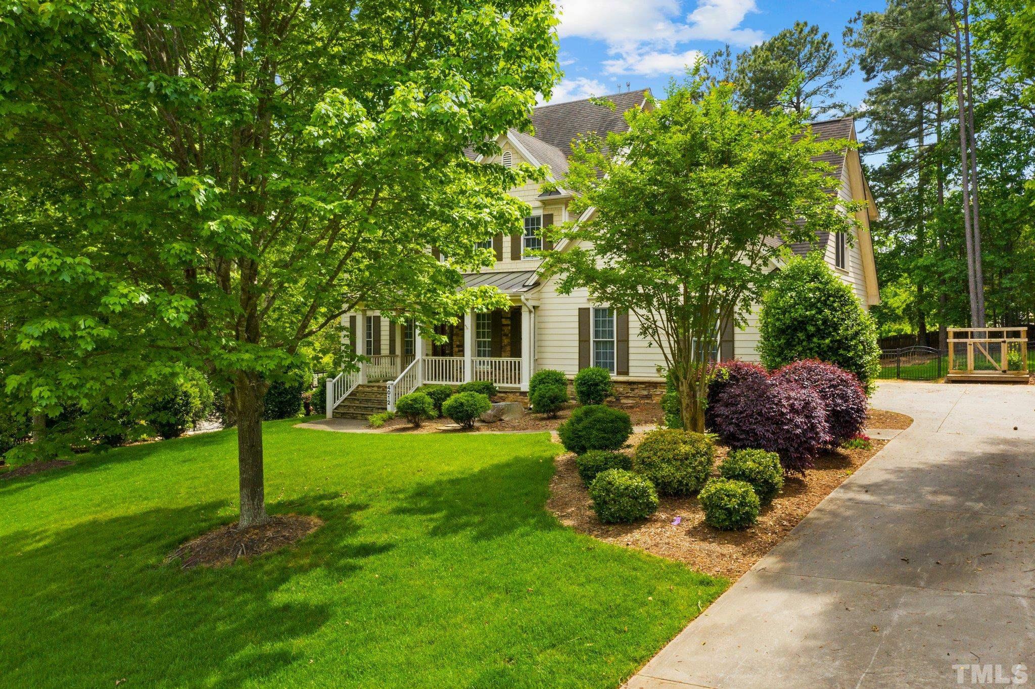 4012 Grandbridge Drive Apex, NC 27539 - Photo 6 of 51 a view of a house with backyard and a tree