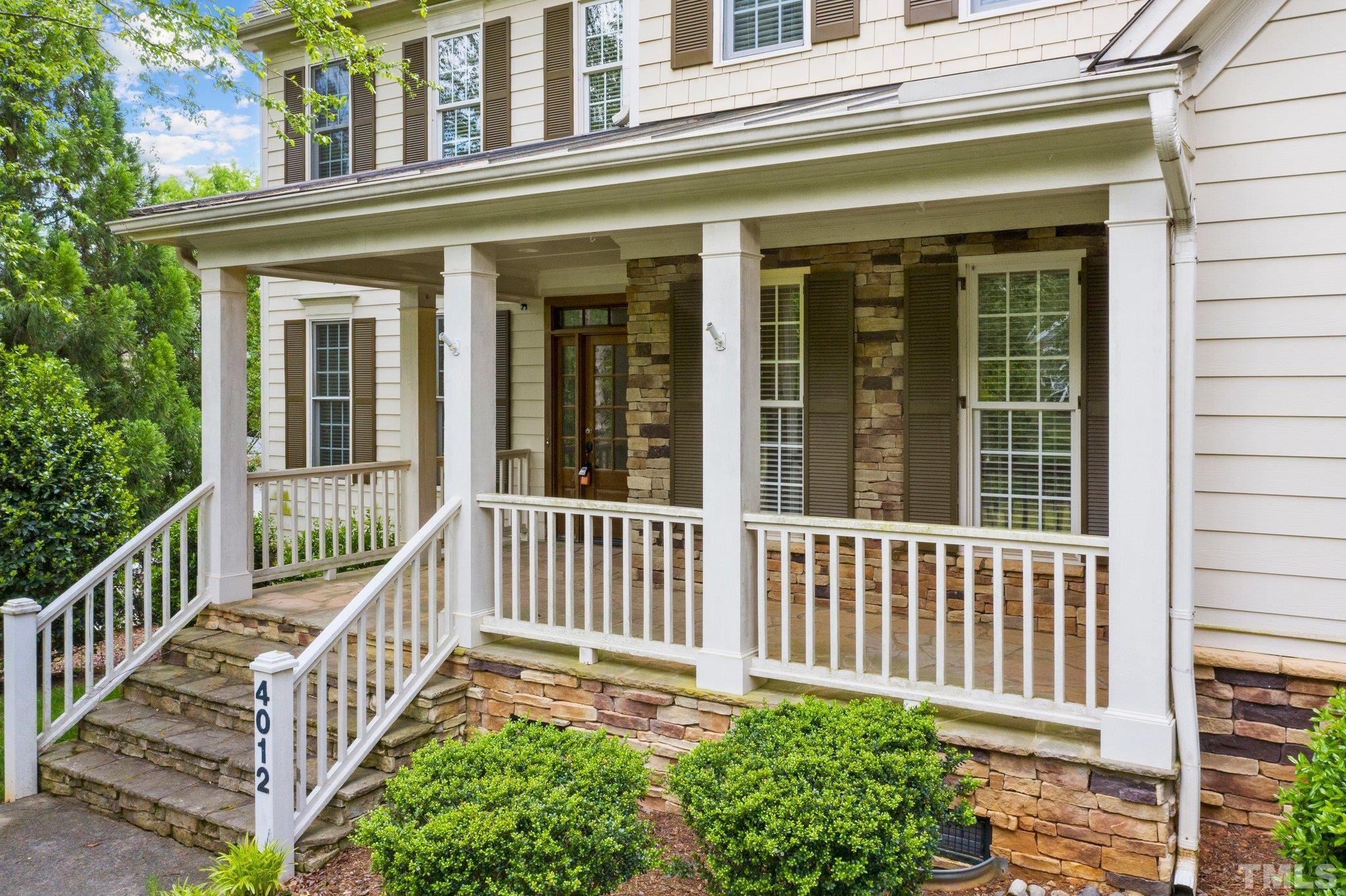 4012 Grandbridge Drive Apex, NC 27539 - Photo 7 of 51 a view of a house with a small yard and wooden floor and fence