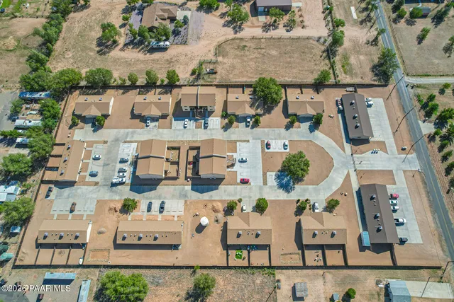 an aerial view of houses with outdoor space