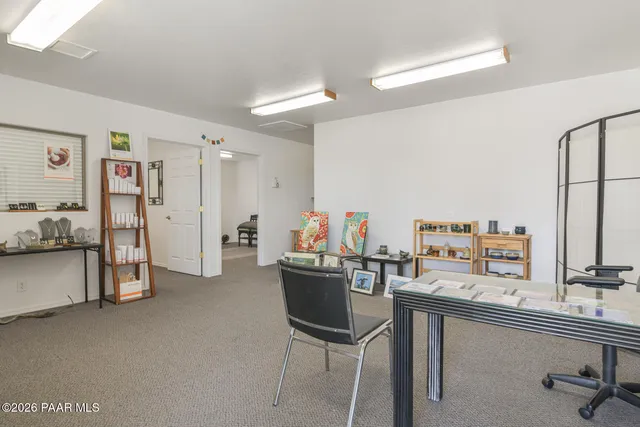 a view of a workspace with furniture