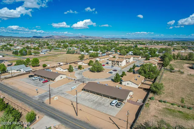 an aerial view of a house with outdoor space
