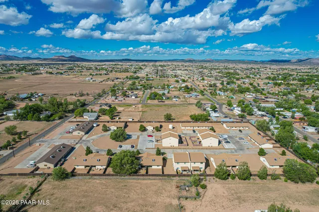 an aerial view of residential building and parking space