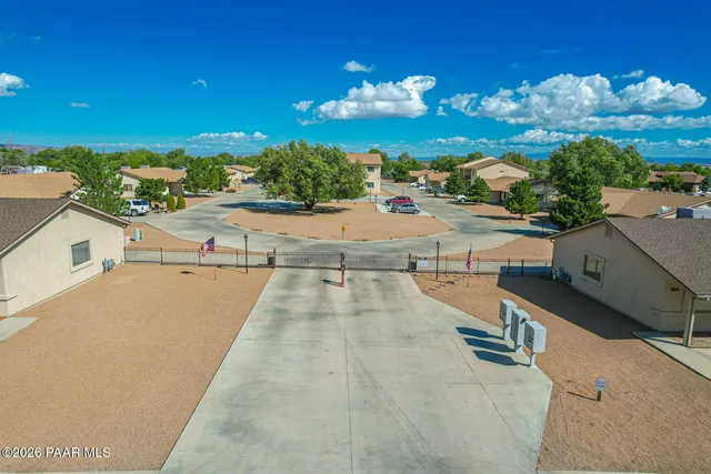 a view of a swimming pool with outdoor seating