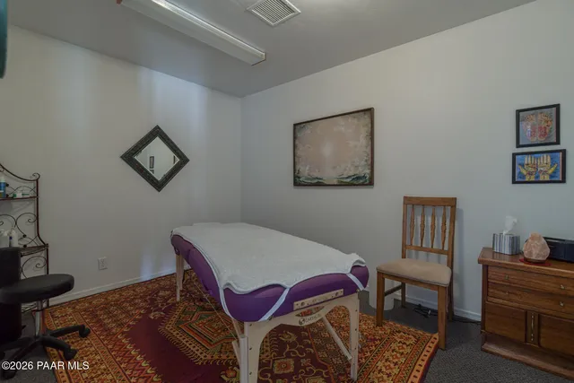 a bedroom with furniture and a bed