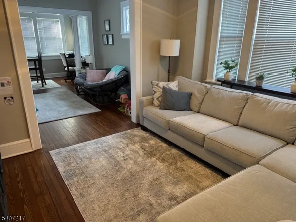 a living room with furniture and a rug