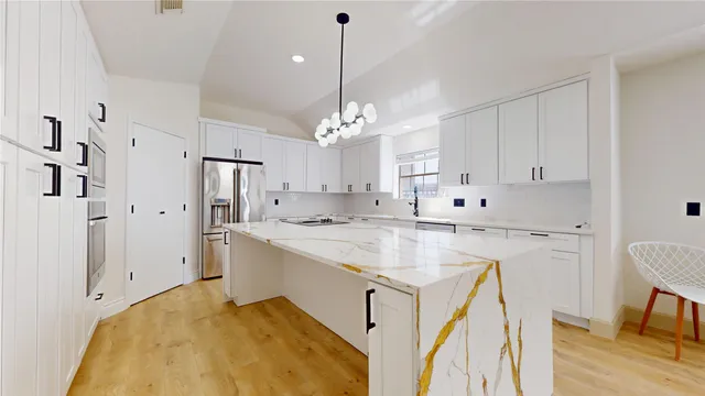 a view of an empty room with a window and a ceiling fan
