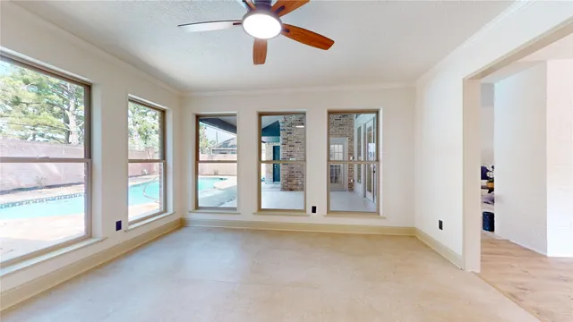 a living room with furniture and white walls