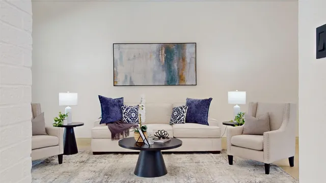 a bedroom with a large bed and a potted plant