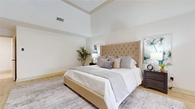 a spacious bathroom with a double vanity sink a toilet and a mirror