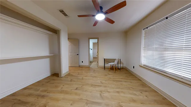 a bathroom with a shower and toilet