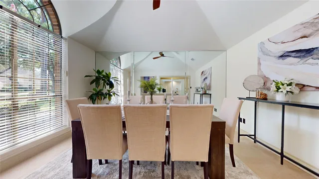 a view of a dining room with furniture and window