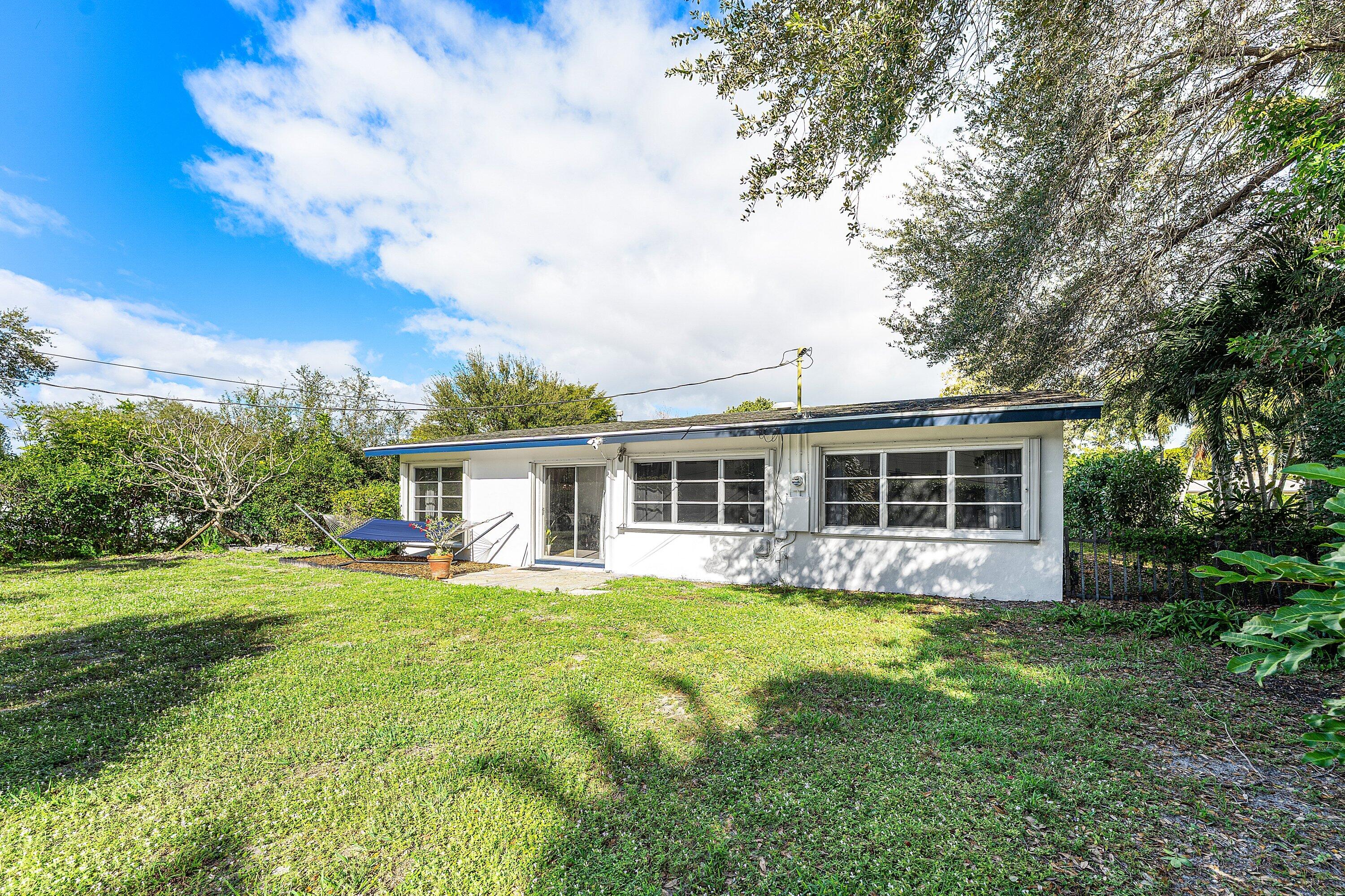 817 Buttonwood Road North Palm Beach, FL 33408 - Photo 22 of 39 a front view of house with yard and green space