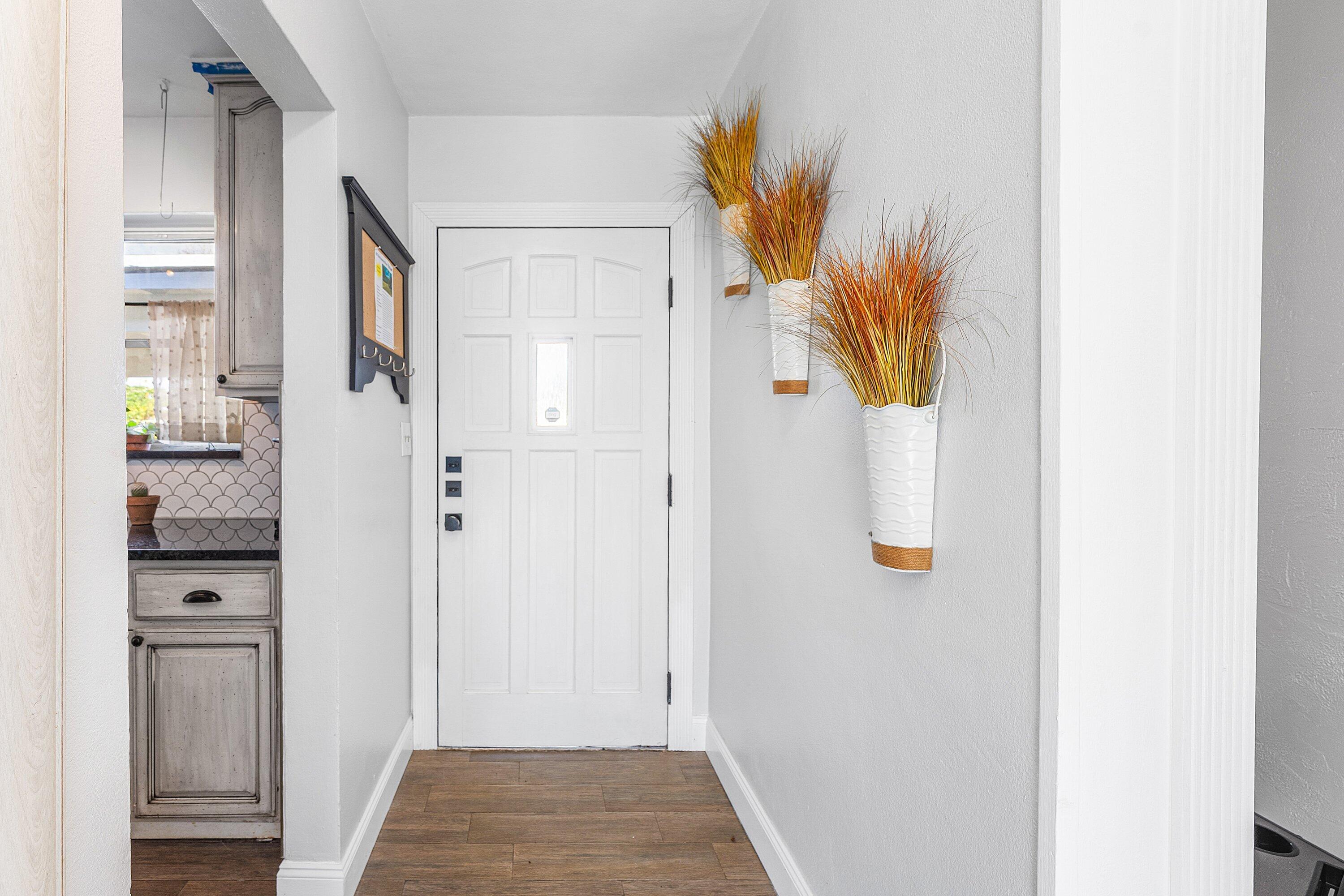 817 Buttonwood Road North Palm Beach, FL 33408 - Photo 3 of 39 a view of a bathroom with a sink and a mirror