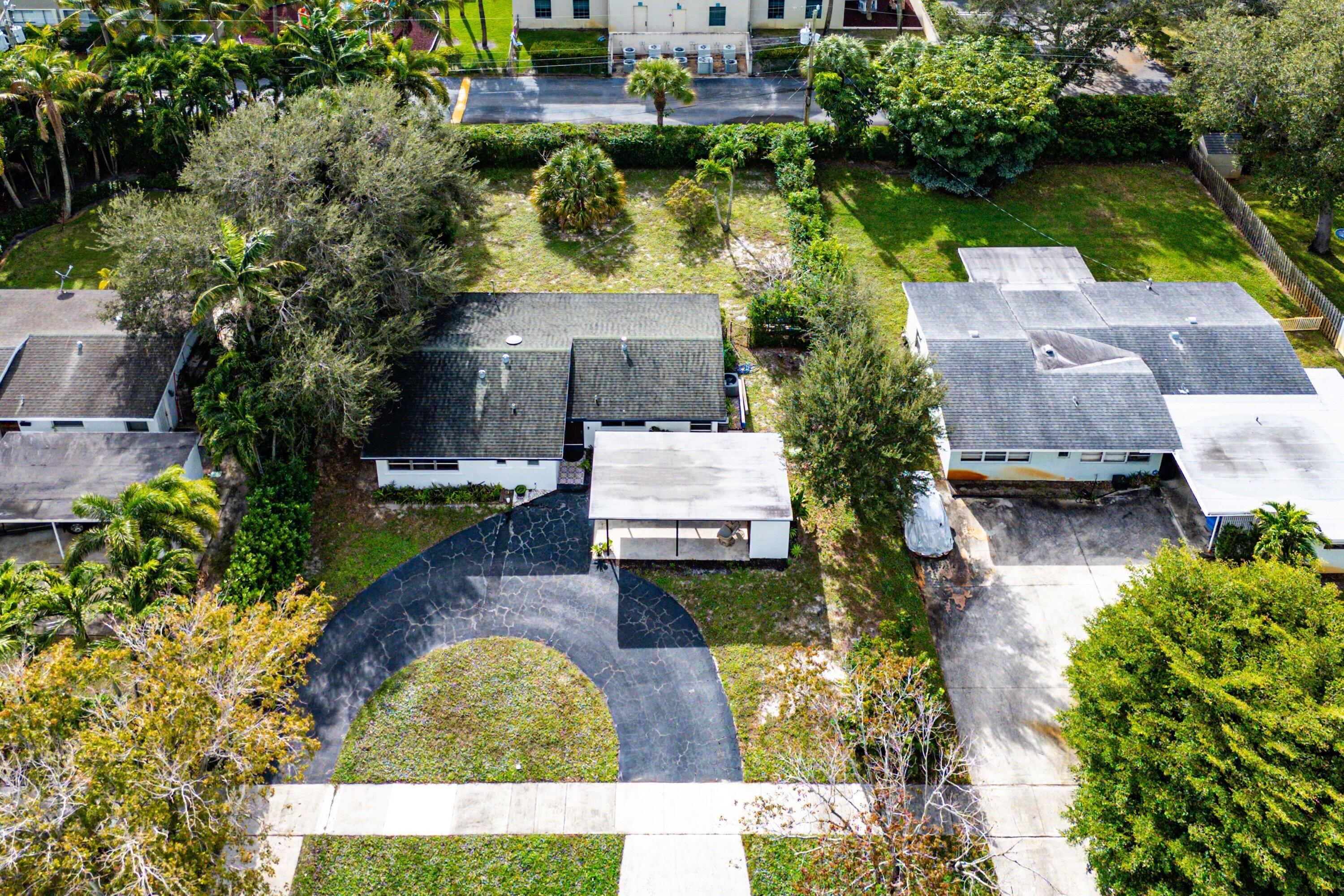 817 Buttonwood Road North Palm Beach, FL 33408 - Photo 31 of 39 an aerial view of a house with a garden and lake view
