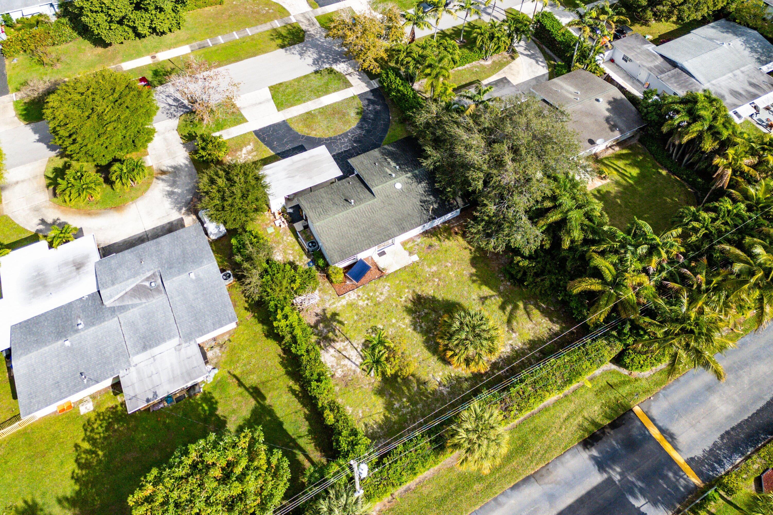 817 Buttonwood Road North Palm Beach, FL 33408 - Photo 34 of 39 an aerial view of residential houses with swimming pool