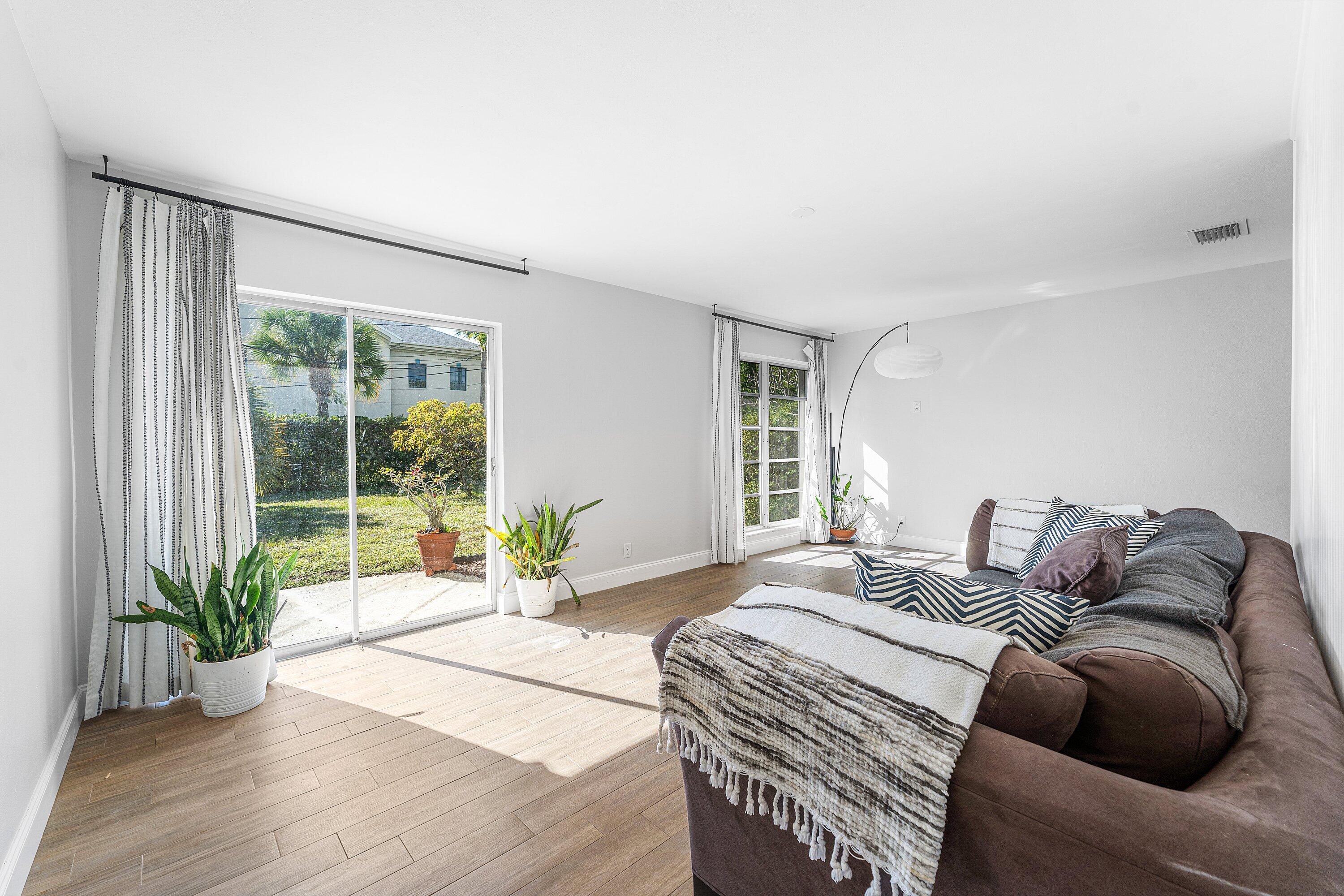 817 Buttonwood Road North Palm Beach, FL 33408 - Photo 5 of 39 a bedroom with a bed and windows