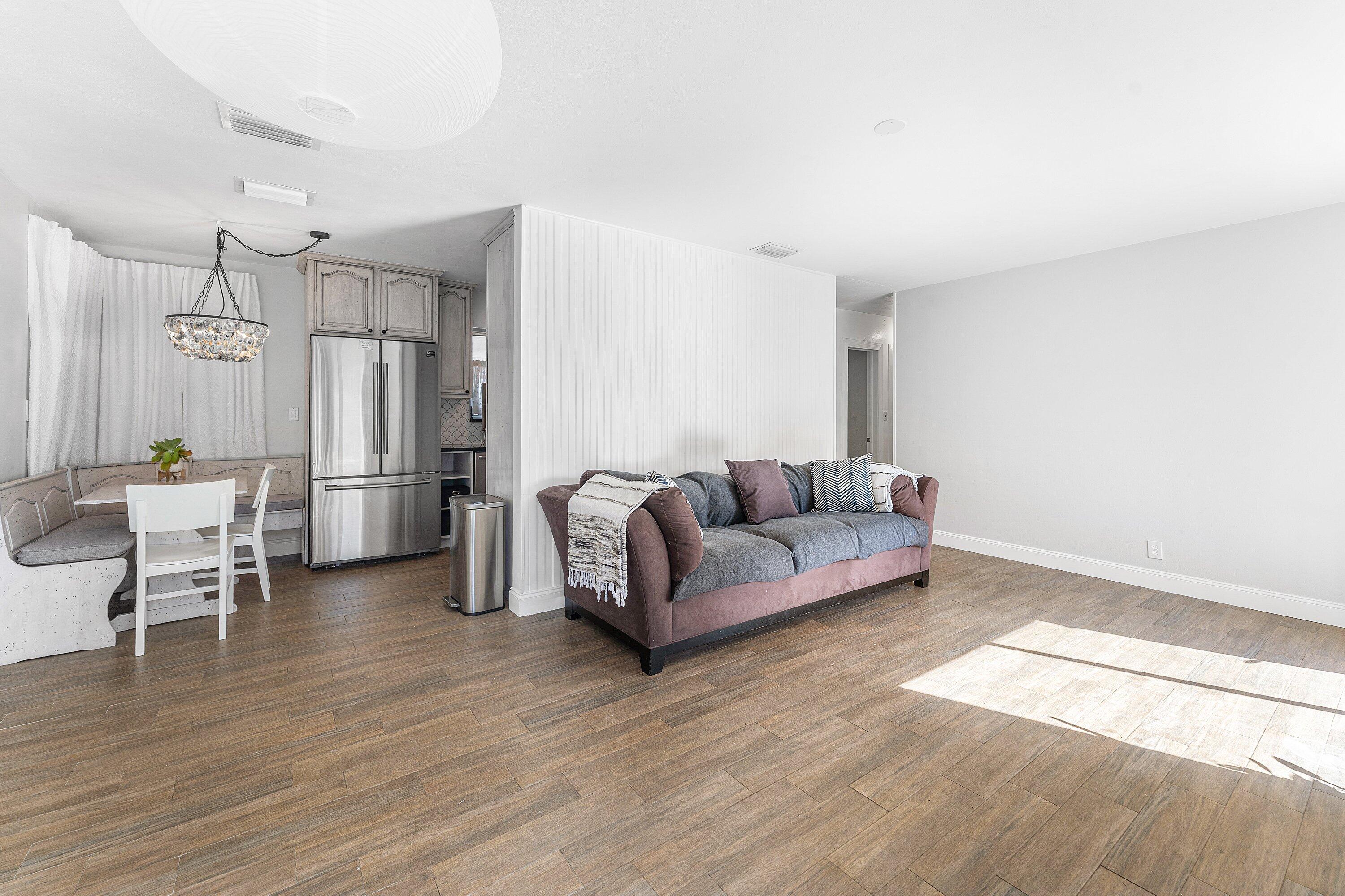 817 Buttonwood Road North Palm Beach, FL 33408 - Photo 7 of 39 a living room with furniture and a wooden floor