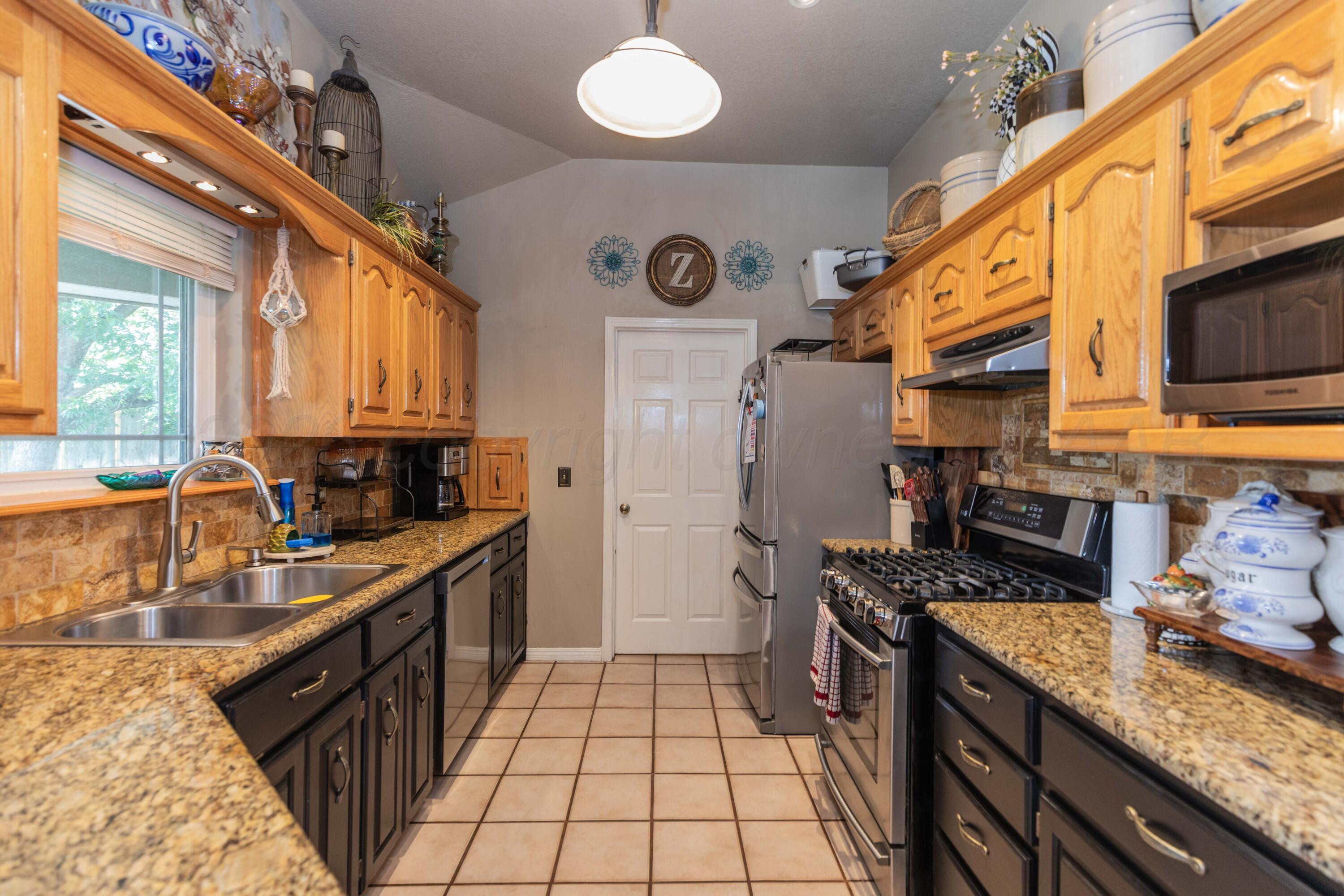 8303 Ranier Drive Amarillo, TX 79110 - Photo 7 of 27 KITCHEN VIEW 1
