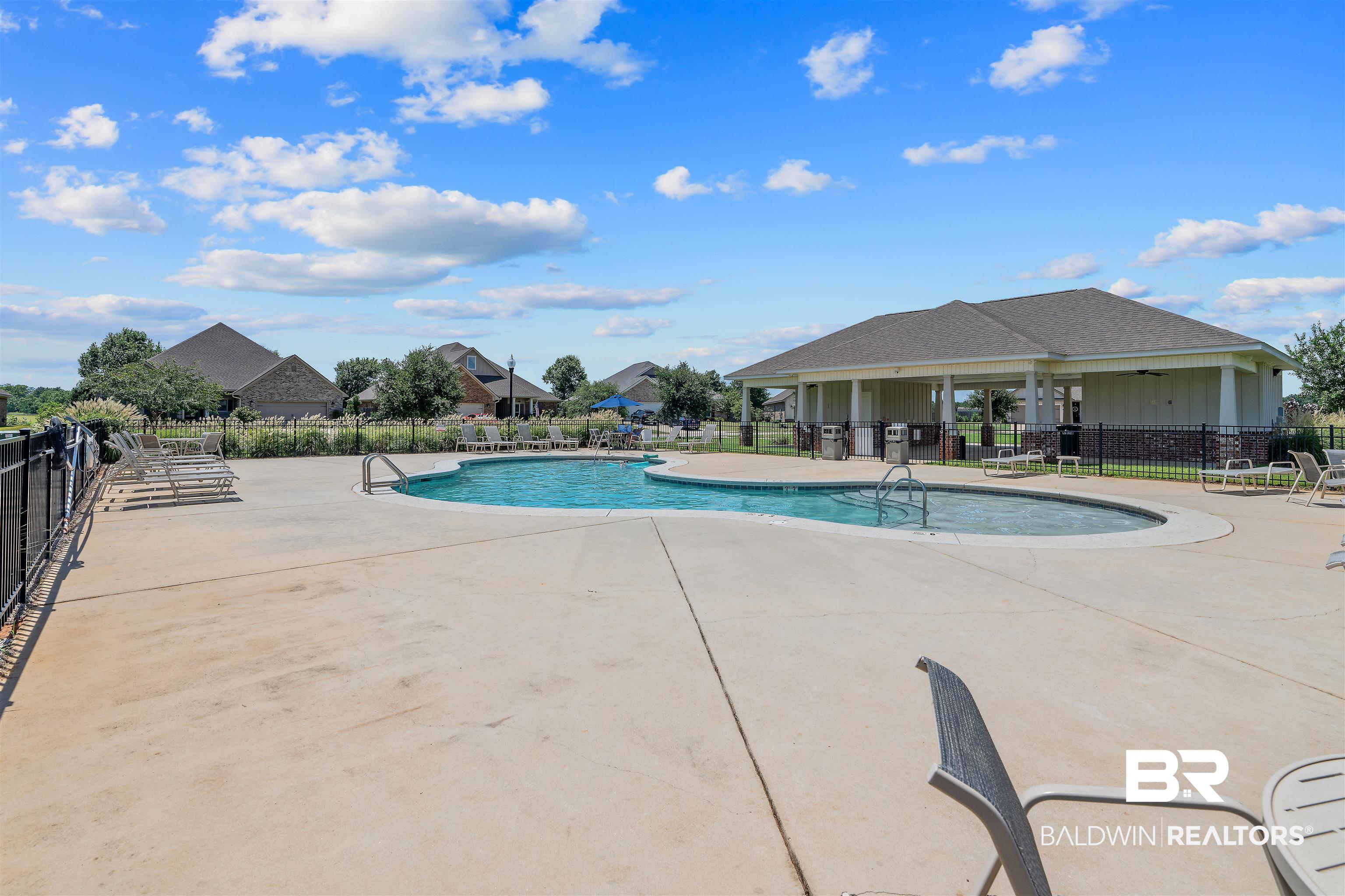 24593 Slater Mill Road Daphne, AL 36526 - Photo 31 of 32 Community pool with a patio