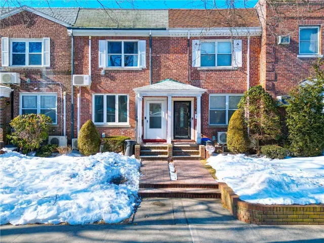 a front view of a building with street view