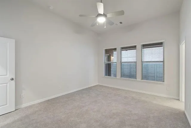 a view of a kitchen with a sink and dishwasher a stove top oven with wooden floor