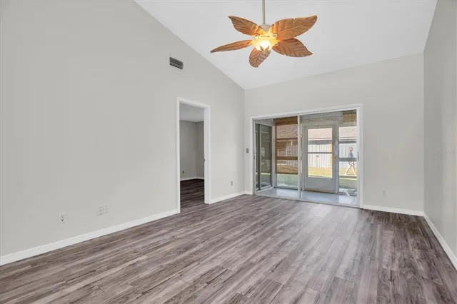 wooden floor in an empty room with a window