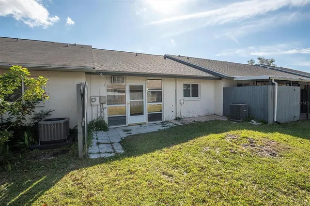 a house view with a backyard space