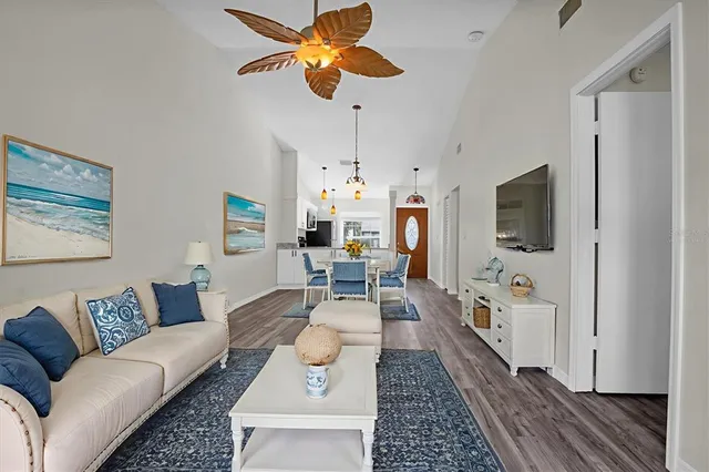 a living room with furniture fireplace and flat screen tv