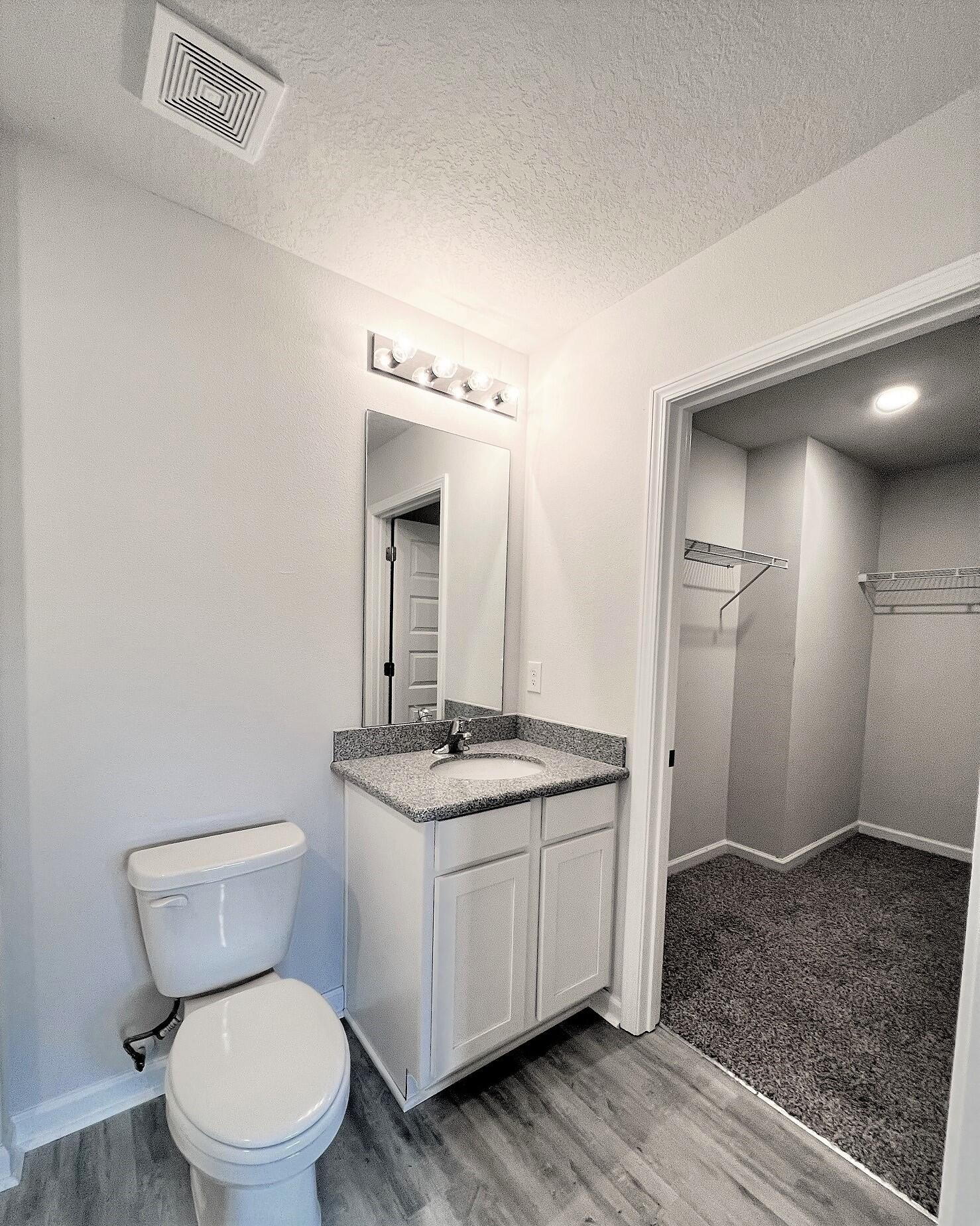 3100 Van Day Way Crestview, FL 32539 - Photo 9 of 16 a bathroom with a toilet sink and mirror