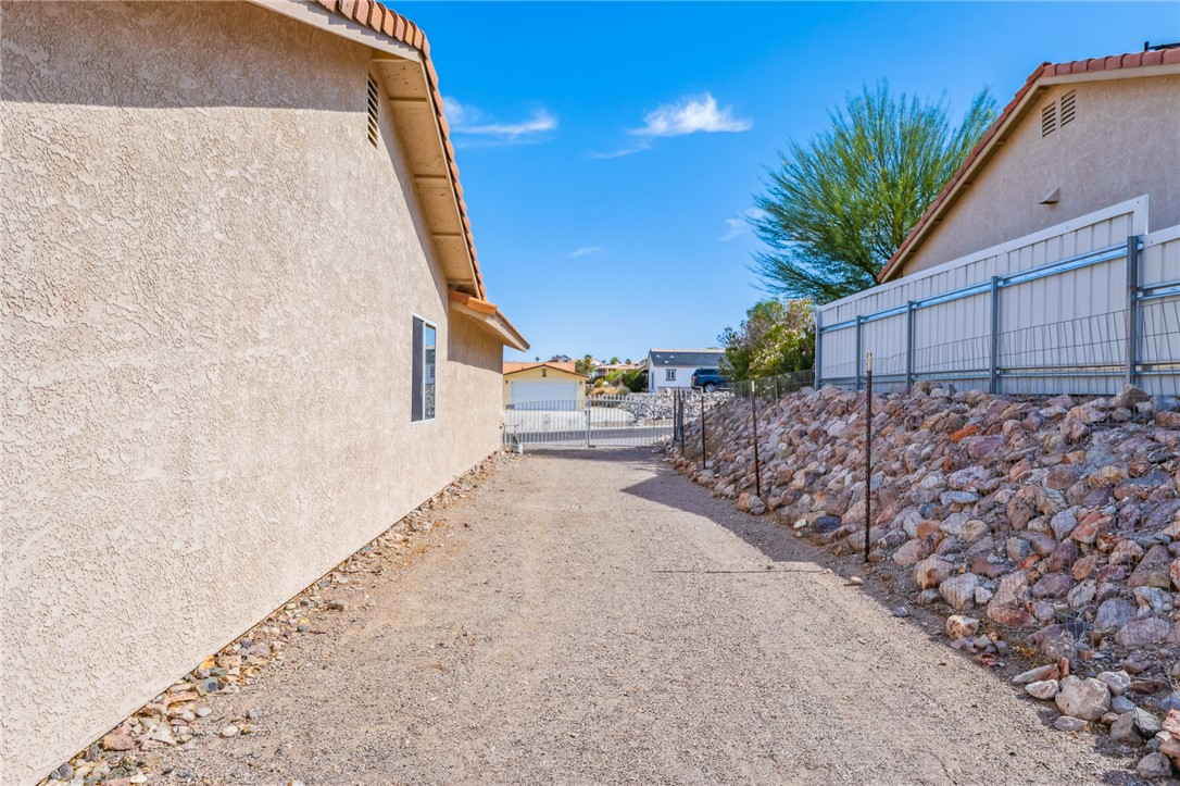 2524 South Ridge Avenue Bullhead City, AZ 86429 - Photo 4 of 64 View of home's exterior with stucco siding