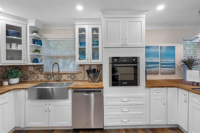 a bathroom with a sink mirror and a bathtub