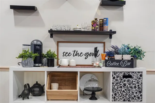 a view of a workspace with furniture and wooden floor