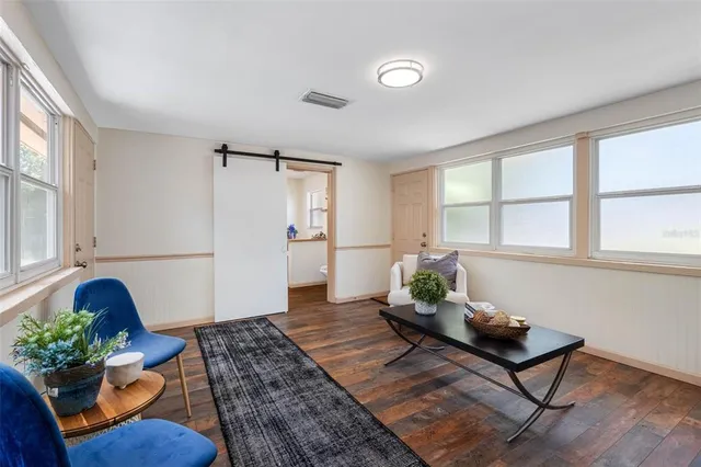 a view of a house with backyard and garden