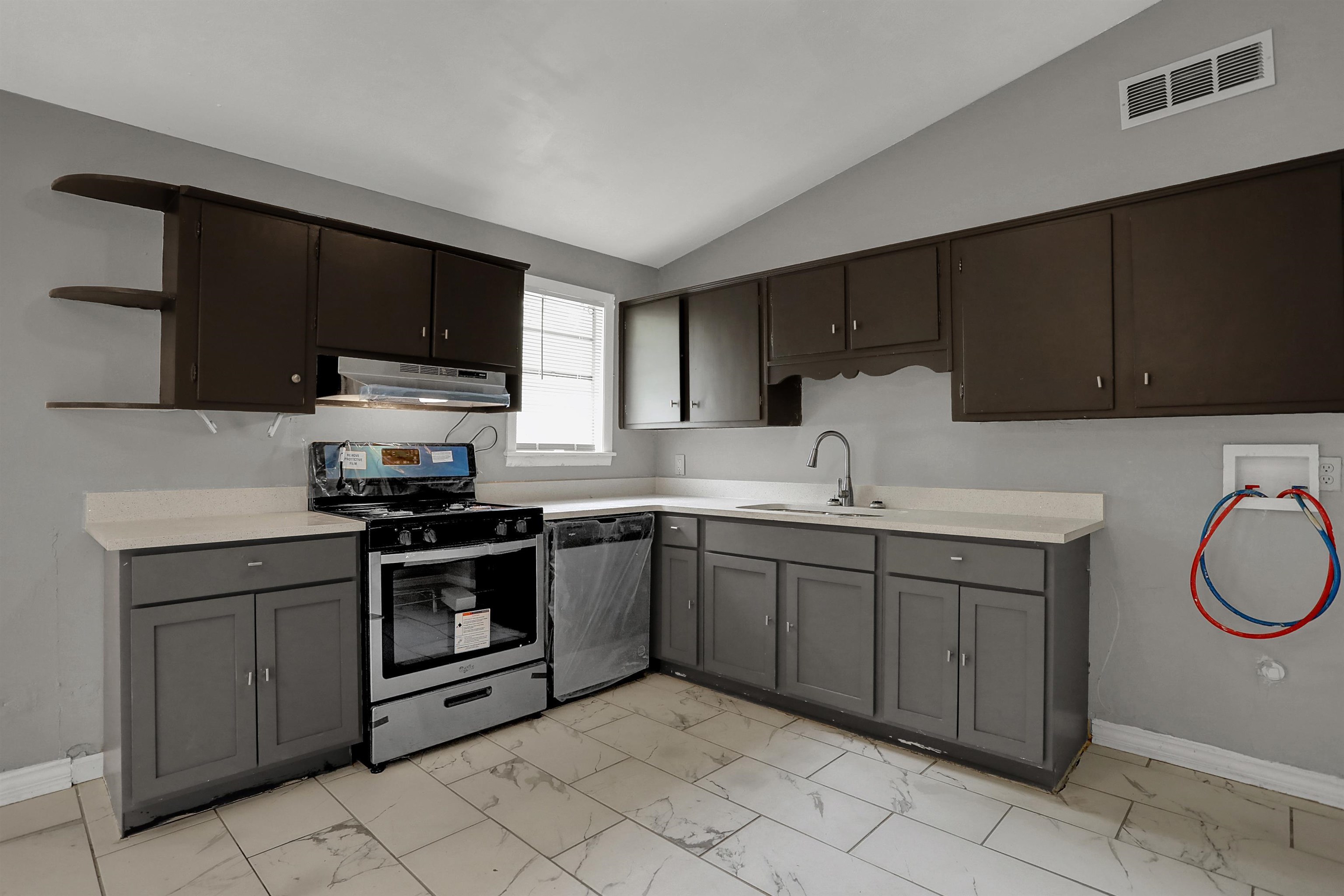 4477 Neely Road Memphis, TN 38109 - Photo 15 of 25 a kitchen with a sink stove and microwave