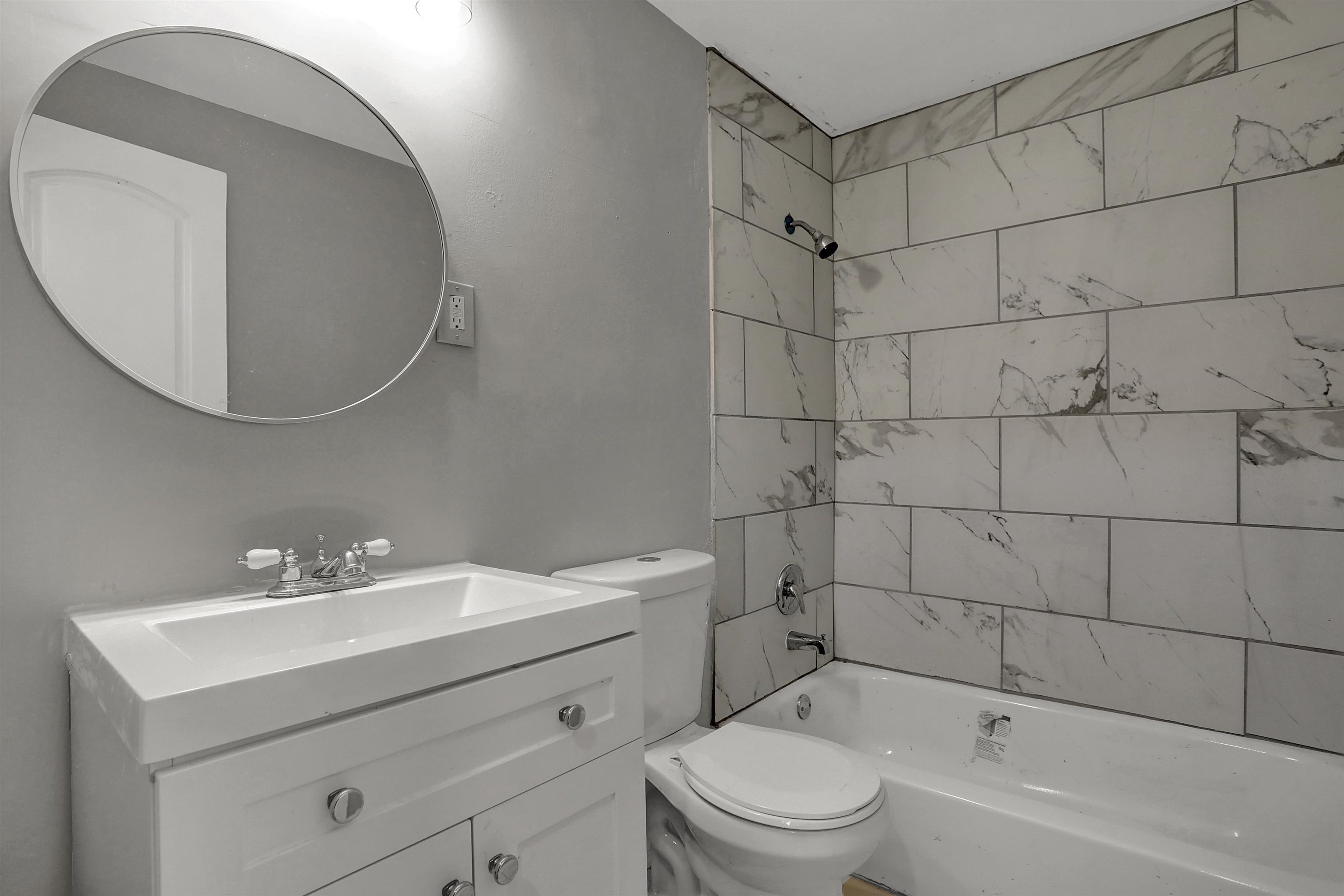 4477 Neely Road Memphis, TN 38109 - Photo 16 of 25 a bathroom with a sink toilet and shower