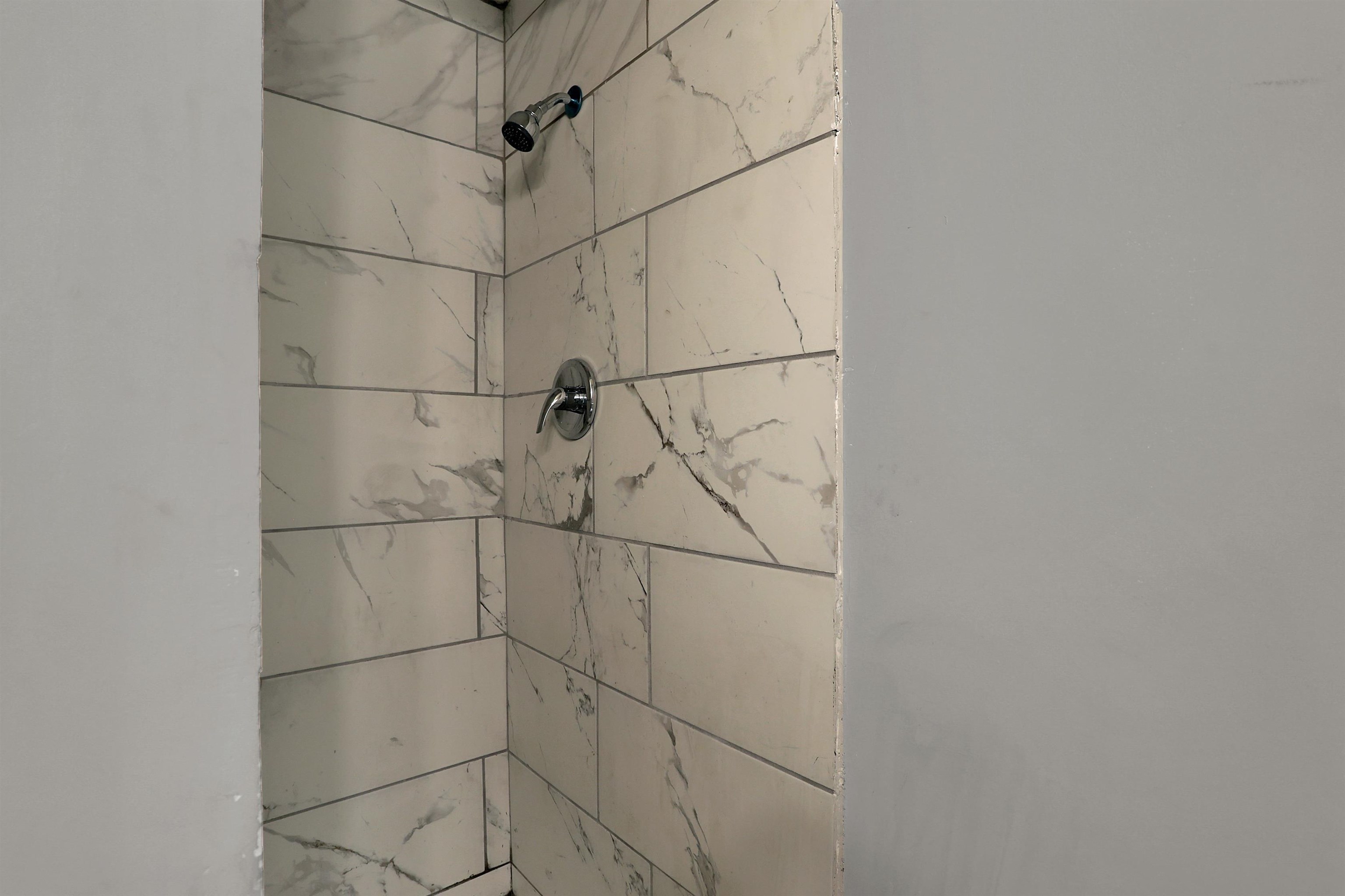 4477 Neely Road Memphis, TN 38109 - Photo 22 of 25 a bathroom with a shower