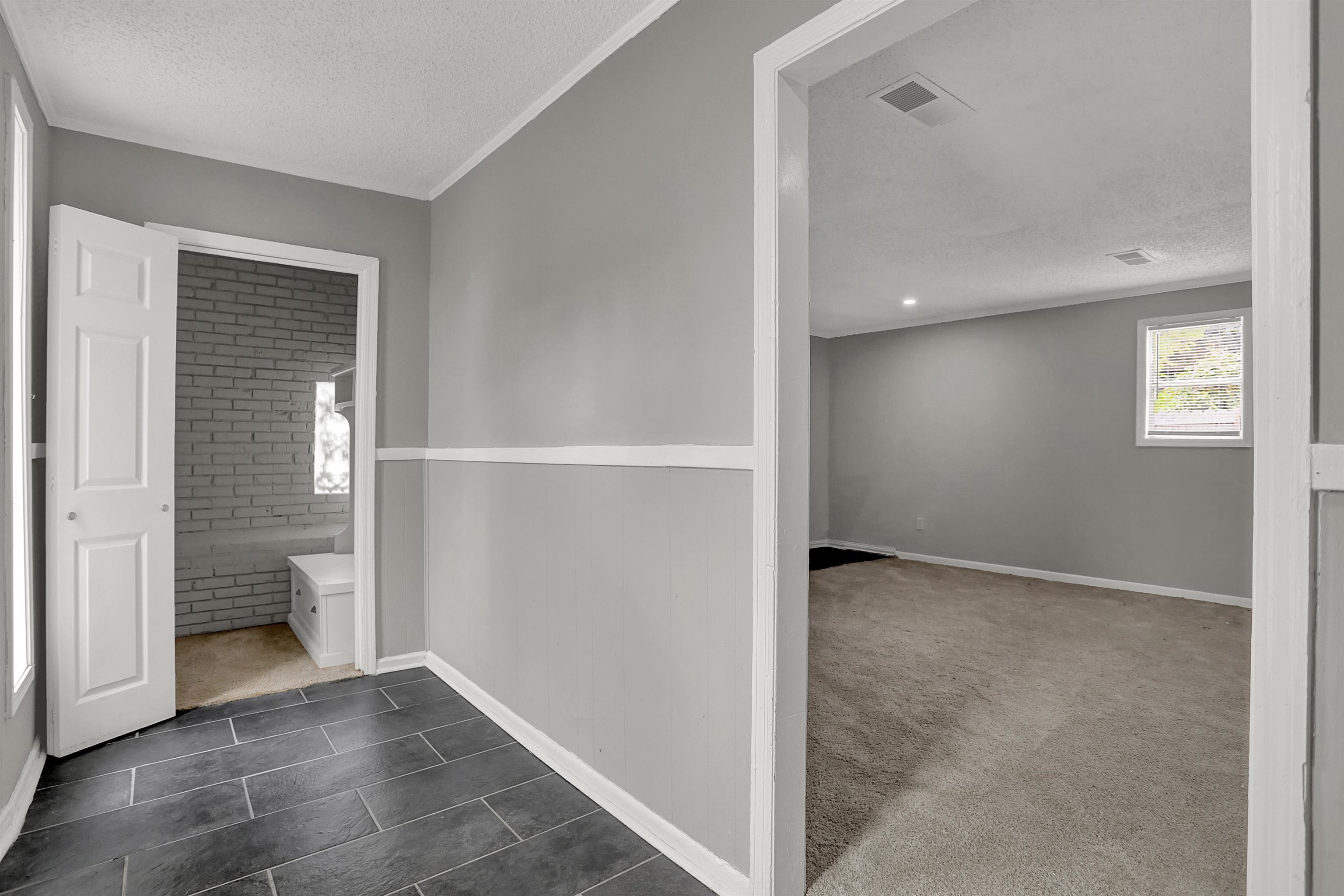 4477 Neely Road Memphis, TN 38109 - Photo 6 of 25 an empty room with windows