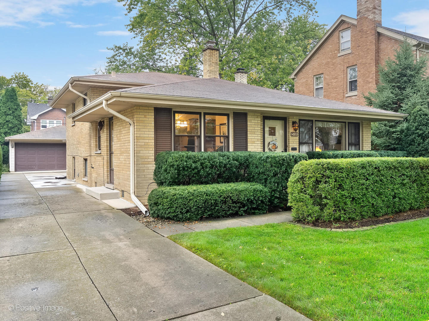 518 North Waiola Avenue La Grange Park, IL 60526 - Photo 1 of 19 a front view of a house with a garden