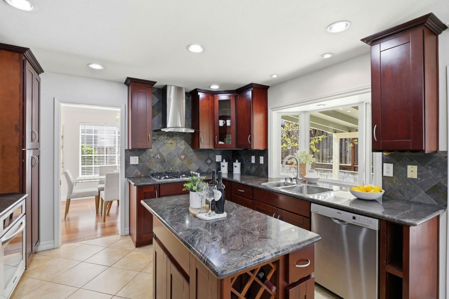 6207 McAbee Road San Jose, CA 95120 - Photo 13 of 48 a kitchen with stainless steel appliances granite countertop a sink and a refrigerator