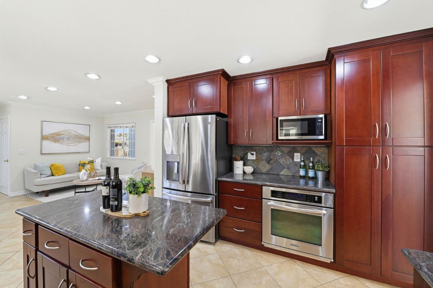 6207 McAbee Road San Jose, CA 95120 - Photo 14 of 48 a kitchen with stainless steel appliances granite countertop a refrigerator and a sink
